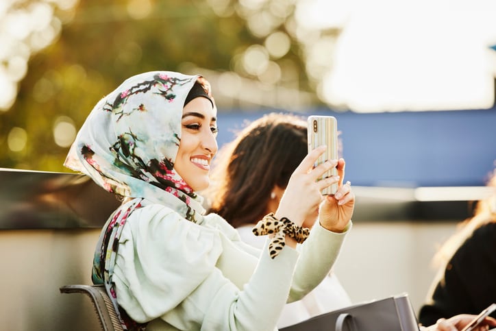 consumer_influencer_social_media_phone_mobile_digital_selfie_woman_middleeast_muslim_online.jpg