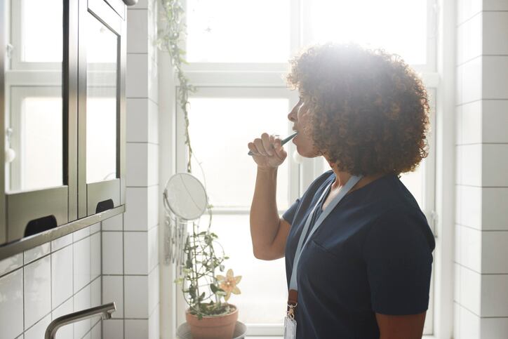 toothbrush_toothpaste_teeth_oralcare_oralhygiene_mouth_health_wellbeing_personalcare_routine_woman_Consumers_trends_bathroom_mirror.jpg