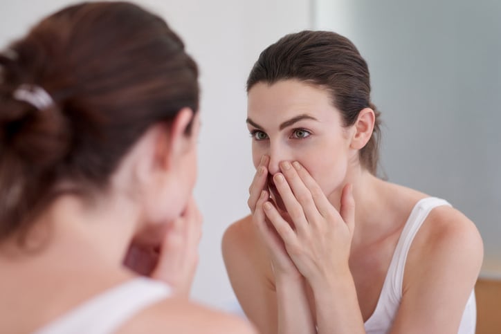 skincare_skin_health_mirror_woman_consumer_bathroom_routine_application_face_hands_hair.jpg