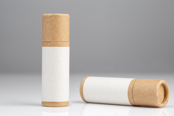 Brown and white carboard tube packaging.